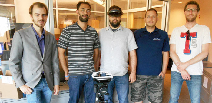 The augmented reality team: Henry Gertsen, John Morales, Brian Bleck (wearing augmented reality headset), Benjamin Katko, and Alessandro Cattaneo