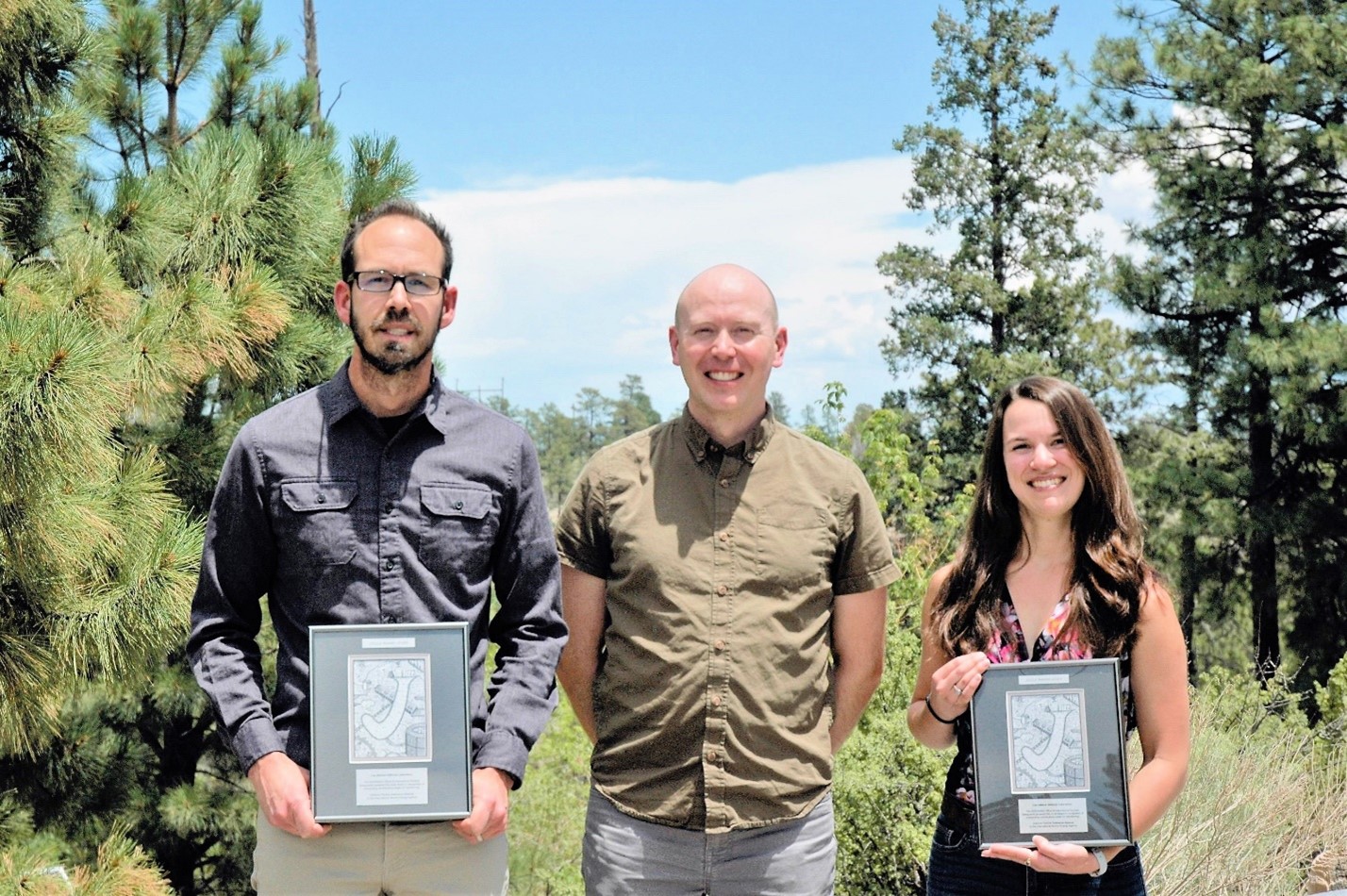 Travis Tenner (center) with Ben Naes and Kim Wurth displaying the team’s Joule awards.