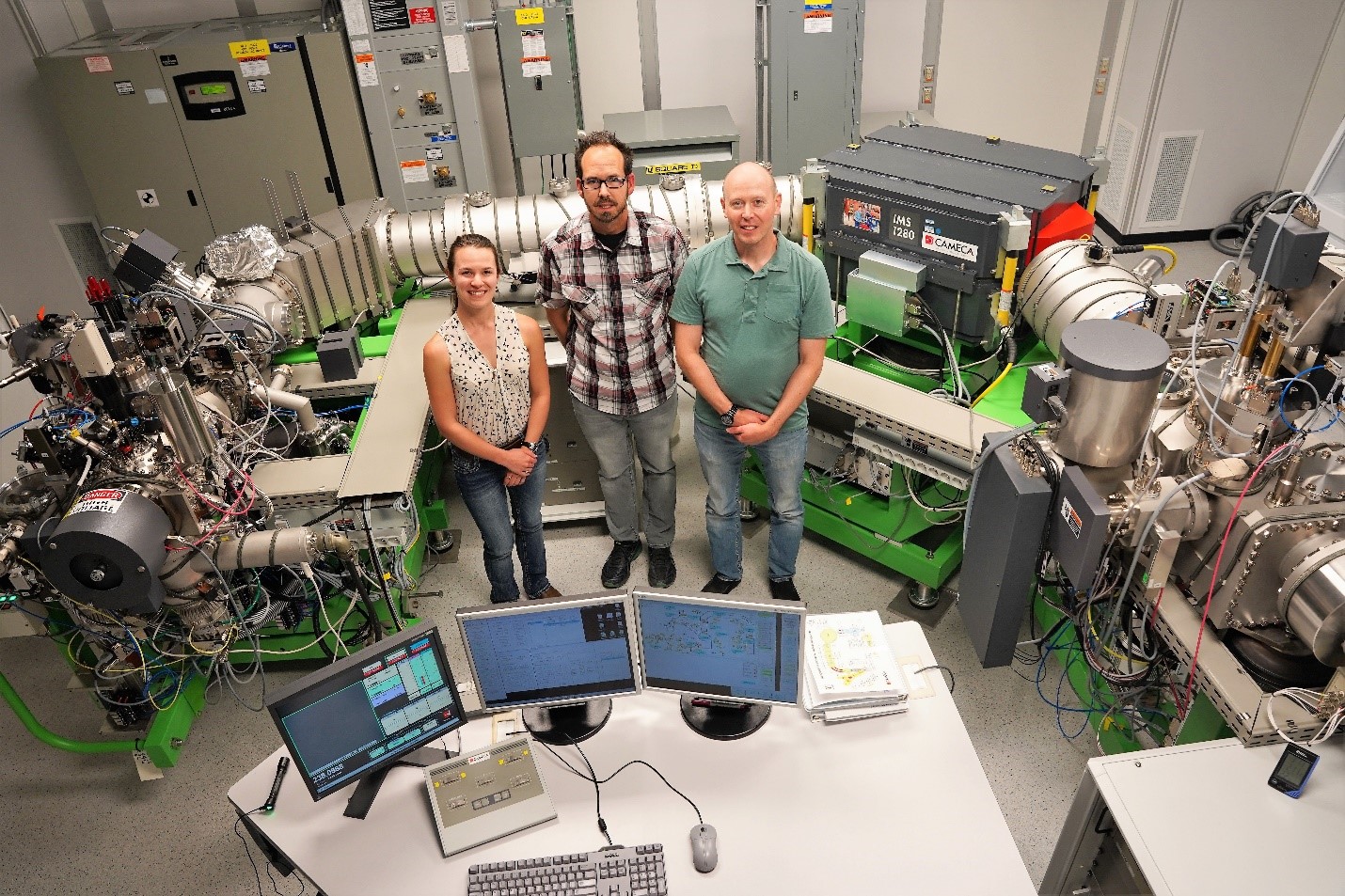 Kim Wurth, Ben Naes, and Travis Tenner with the LG-SIMS instrument