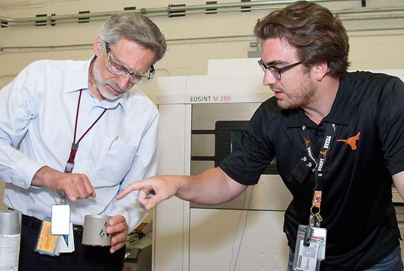 (Right): Cameron Knapp (Sigma Division, SIGMA-DO) shows Laboratory Director Charlie McMillan a sample that was created using additive manufacturing techniques. 